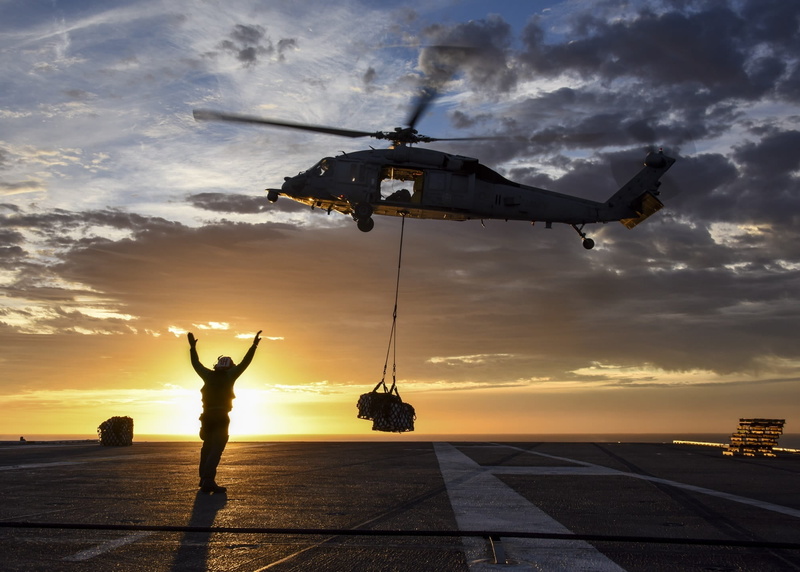 replenishment, silhouettes, daytime, cargo, flying, uss carl vinson, silhouette, supplies, military, water, adults only, aircraft, helicopter, adult, clouds