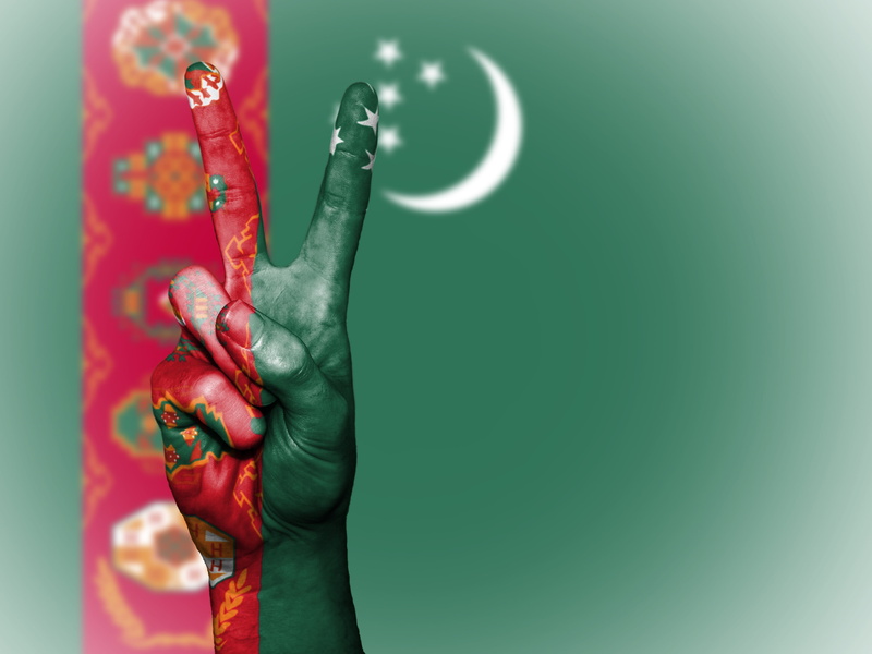 vibrant color, national, indoors, water, holding, people, flag, art and craft, one person, nation, travel, banner, background, human arm, icon, colored background