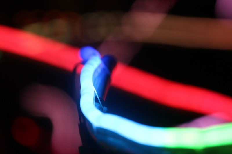 lower hutt, shape, red, selective focus, close-up, light - natural phenomenon, multi colored, glowing, pattern, black background, illuminated, blue, focus on foreground