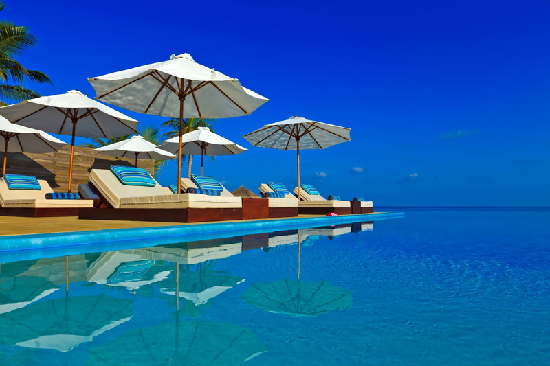 swimming pool, parasol, outdoors, 1080P, day, sea, scenics - nature, waterfront, nature, clear sky, shade, water, lounge chair, sky, tropical, horizon over water