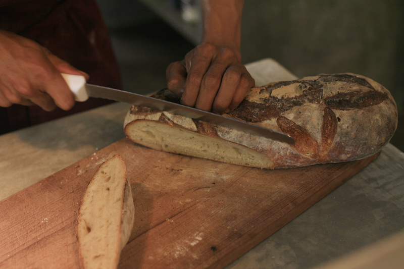 hand, breads, indonesia, indoors, hands, freshness, kitchen knife, loaf of bread, preparing food, bread, bread slice, lombok, making bread, food, gemtrack