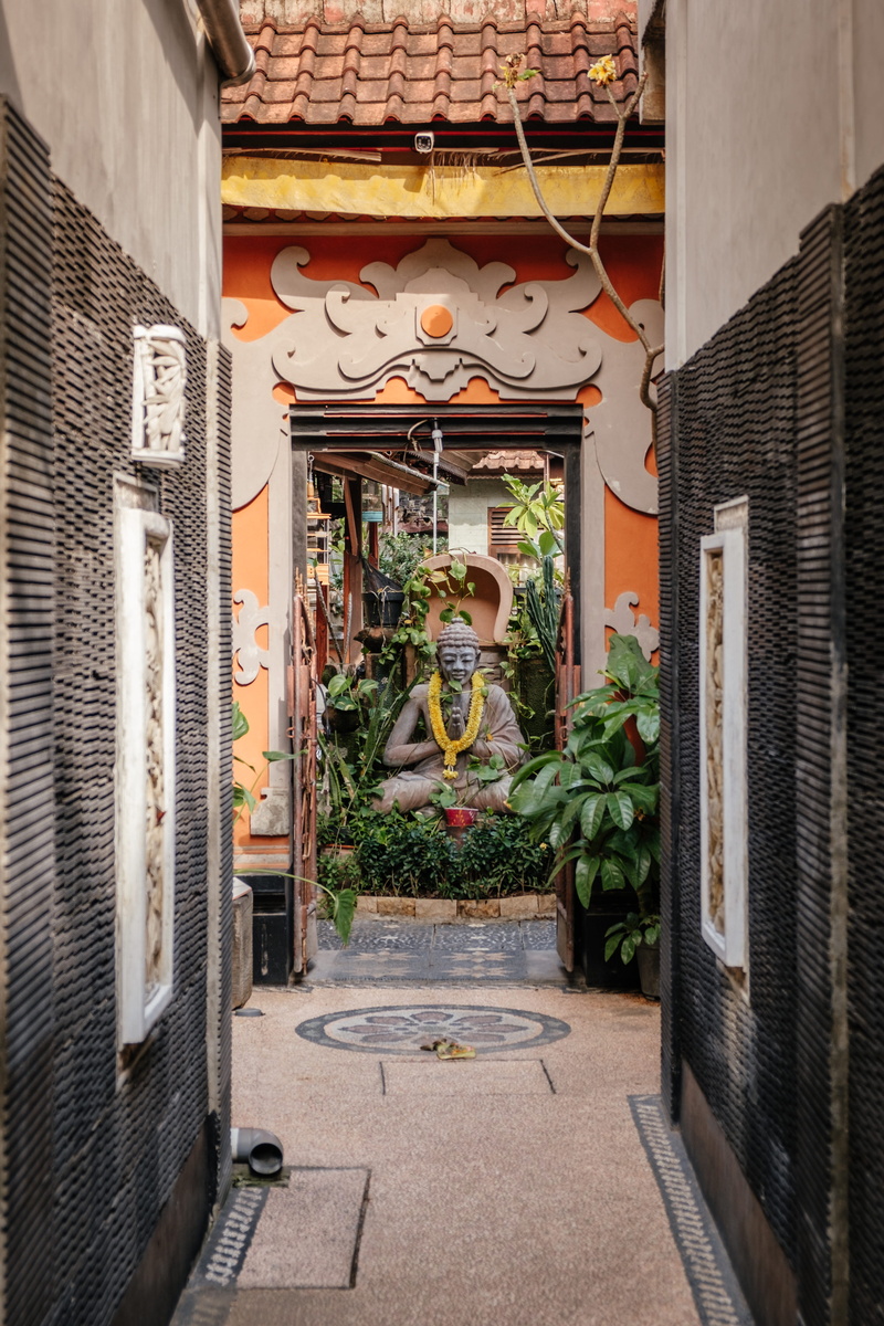 floor, lighting equipment, jar, kuta, apparel, day, architecture, potted plant, pottery, creativity, person, entrance, no people, nature, walkway, art and craft