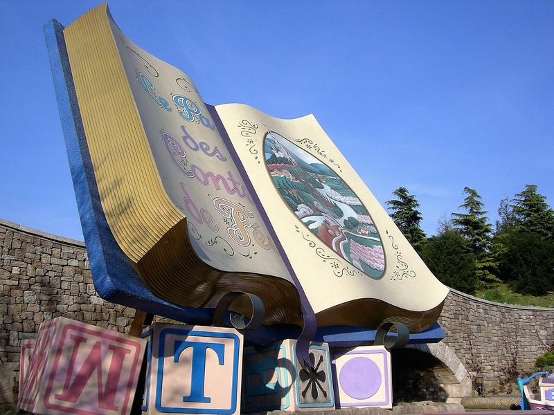 read, no people, outdoors, plant, communication, built structure, clear sky, day, disneyland paris, creativity, craft, representation, building exterior