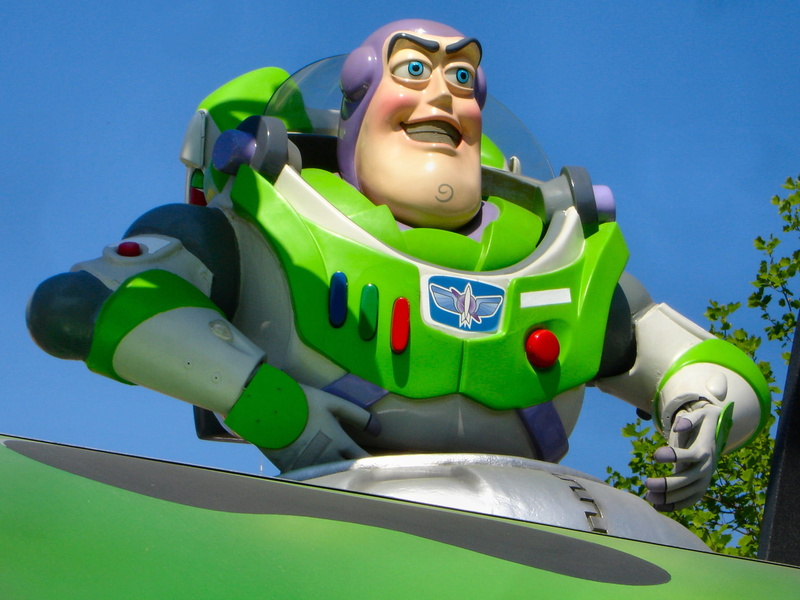 toys, low angle view, paris, outdoors, people, arts culture and entertainment, disneyland, sunlight, buzz lightyear, sport, front view, male likeness, Disneyland Paris