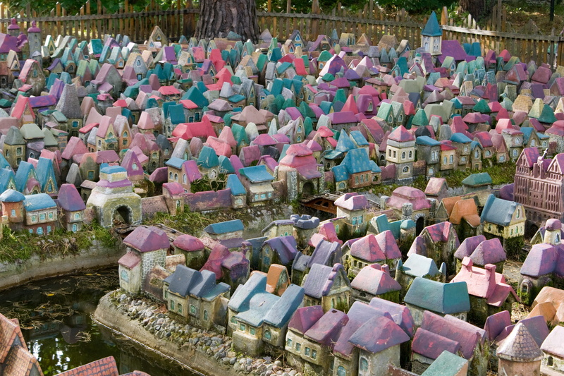 outdoors, multi colored, hanging, sculpture, in a row, layout, fantasy, high angle view, belief, spirituality, 4K, town, side by side, miniature, houses