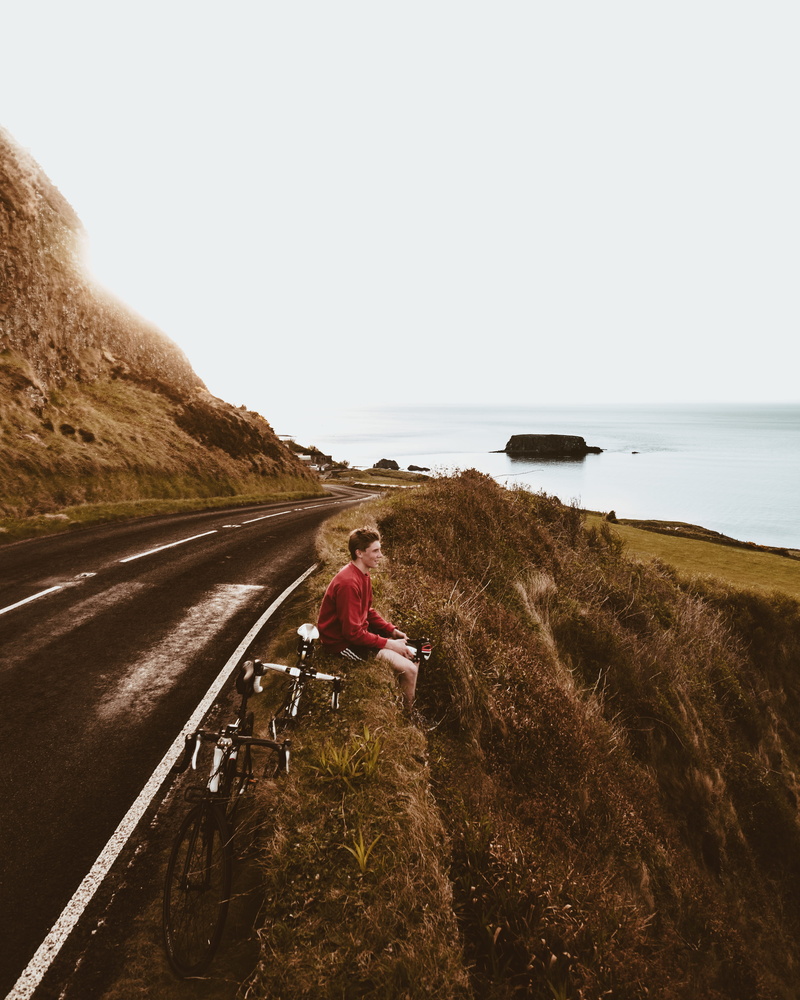 claud butler, northern ireland, moment, causeway coast, climb, copy space, sea, one person, land, clear sky, cycling, nature, island, road, giants causeway