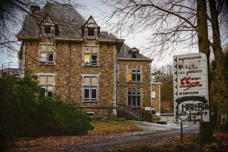 decay, house, clinic, concrete, building, bare tree, lost places, road, old, window, city, built structure, text, building exterior, sky, near, clouds