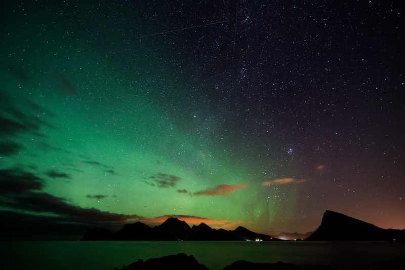 fish, outdoors, night, mountains, star field, animal, sky, aurora, clouds, green color, star, tranquil scene, borealis, tranquility, universe, starry sky