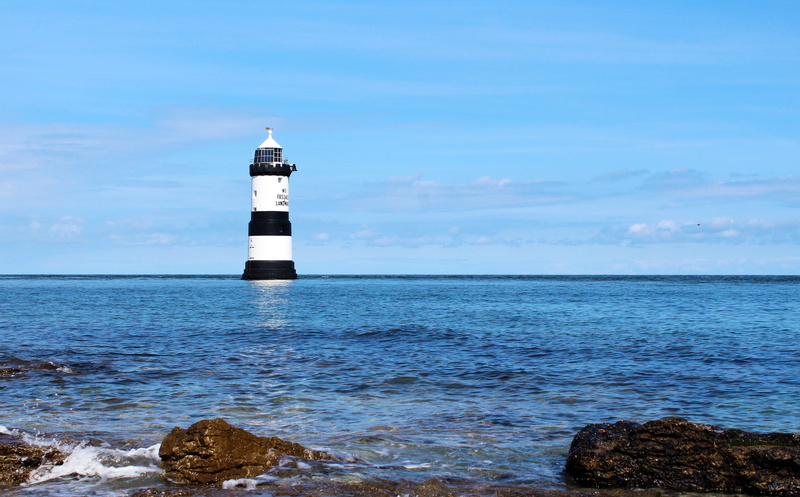 security, nature, built structure, architecture, beauty in nature, no people, outdoors, coastline, lighthouse, water, ocean, direction, penmon, building exterior