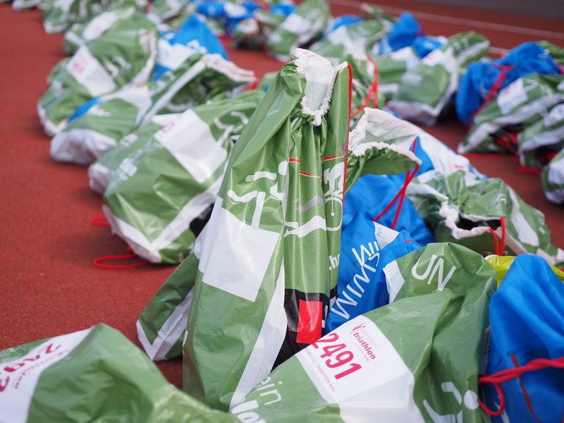 plastic bag, selective focus, finance, focus on foreground, exchange dresses, a change of clothes, large group of objects, numbered, garbage, no people