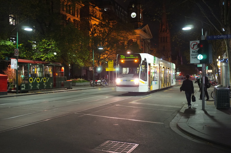 built structure, city, transportation, lighting equipment, building exterior, tram, illuminated, yarra tram, walking, architecture, men, incidental people