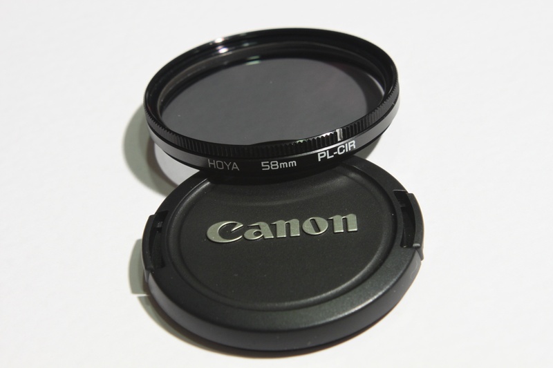 circular, container, text, photographic, personal accessory, polarising, shape, communication, photography, circle, black color, two objects, pl-cir, studio shot