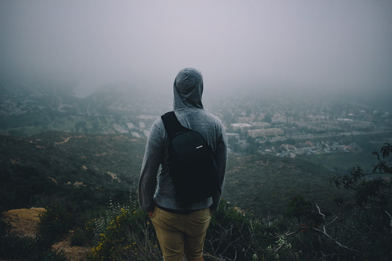 haze, backpack, fog, rear view, one person, sweatshirt, top, landscape, peek, standing, casual clothing, real people, pullover, leisure activity, city