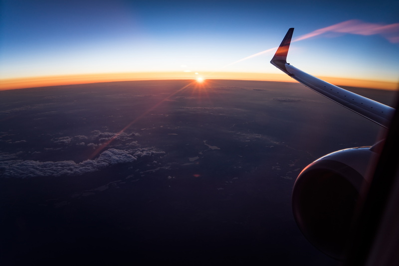 environment, horizon, jet engine, aircraft wing, mode of transportation, yellow, Sun, lens flare, outdoors, transportation, mid-air, travel, black, sky