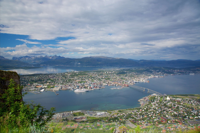 building, beauty in nature, yacht, transportation, norway, architecture, mountain range, city, tromso, building exterior, day, high angle view, bay, cloud - sky