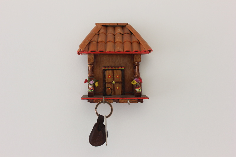 white background, pattern, indoors, art and craft, food and drink, still life, small, architecture, single object, house, keychain, no people, wood - material
