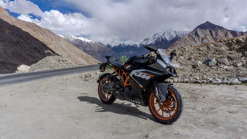 day, stationary, bike, environment, himalayas, land vehicle, travel, mountain, landscape, formation, snow, nubra valley, adventure, motorcycle, cloud - sky