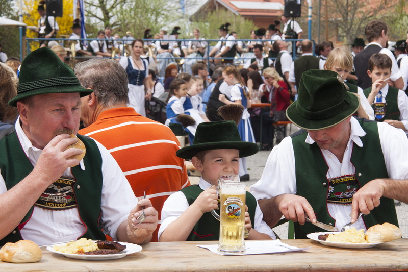 brown, costume, men, costumes, two, snack, drinking, child, adult, fraternity, hat, tradition, males, sitting, potato salad, crowd, eating, table, human