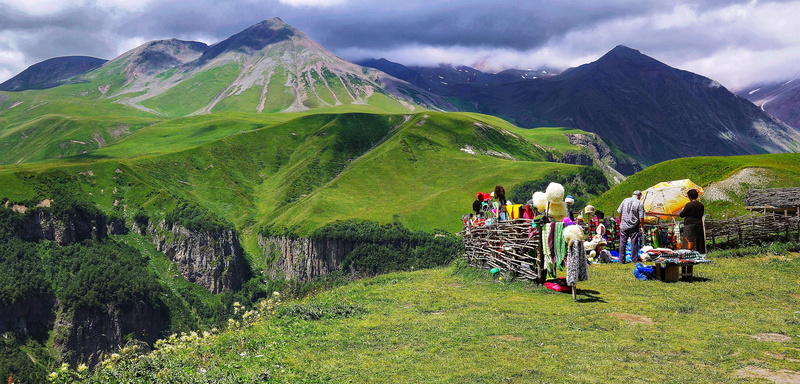 mountain range, land, sky, homemade, tranquil scene, men, landscape, environment, green color, mountains, destination, nature, group of people, caucasus