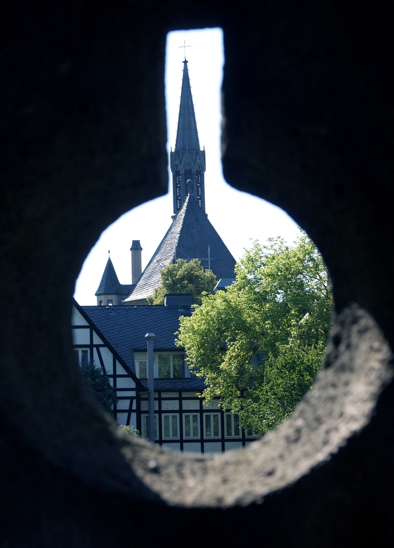 steeple, building, shape, andernach, spire, opening, religion, sky, place of worship, hole, catholic, tree, outdoors, belief, plant, wrought iron, selective focus