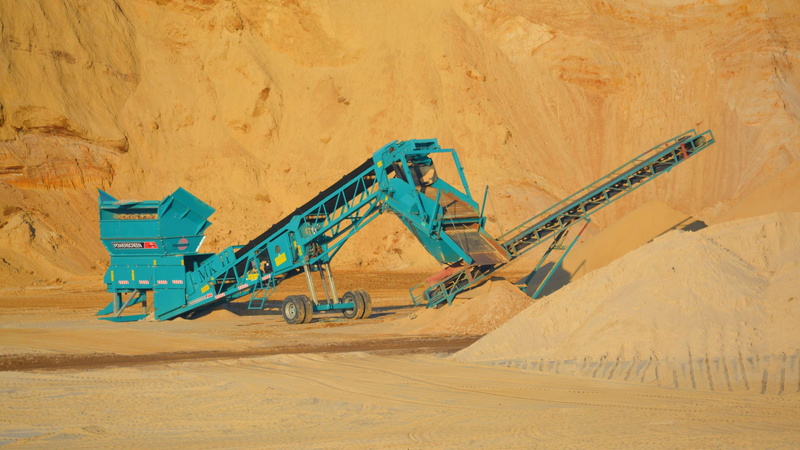 day, quarry, sand, construction equipment, outdoors, earth mover, mortar factory, sunlight, mine, no people, construction site, nature, transportation