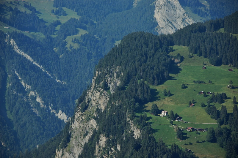 day, mountain peak, plant, top, nature, cliff, scenic, neighborhood, trees, houses, aerial view, beauty in nature, aerial, grass, tranquil scene, high angle view