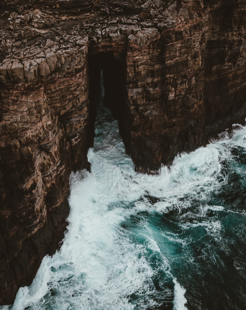 mountain, rock formation, flowing, beauty in nature, 2K, crash, aerial view, cliff, coast, seascape, physical geography, waterfront, tide, cave, geology