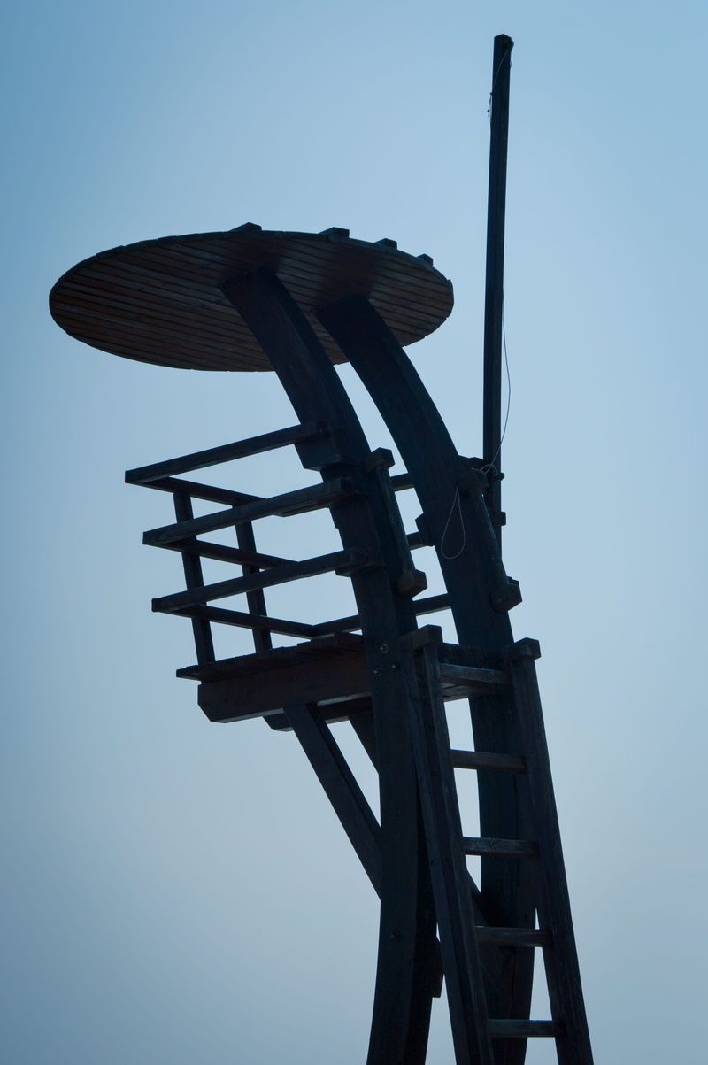 low angle view, clear sky, outdoors, bridge - man made structure, fuel and power generation, industry, sky, sun, blue, shadow, wood, object, pattern, nature