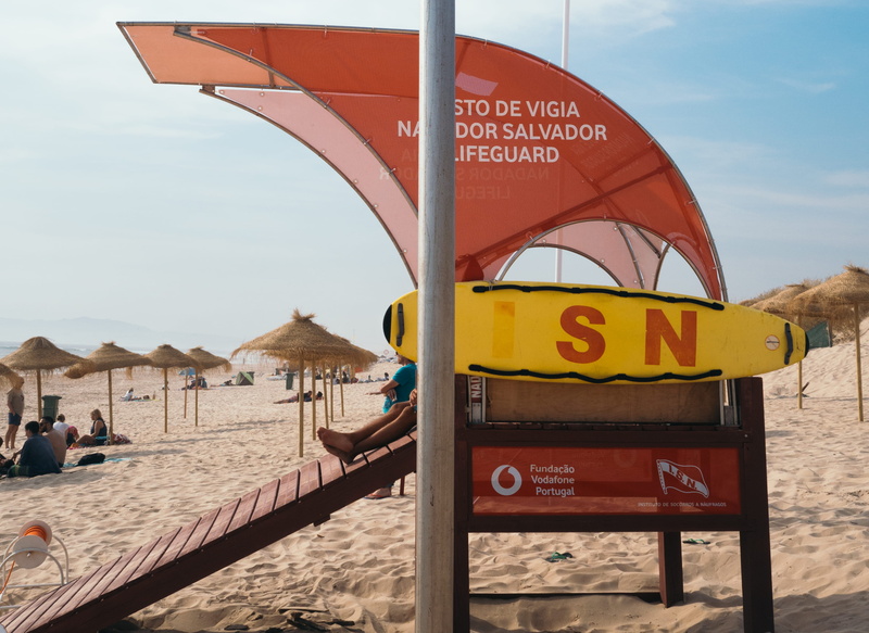 lifeguard station, shore, street sign, blue, nature, costa da caparica, structure, soil, person, parasol, 2K, surfboard, text, sign, road sign, information
