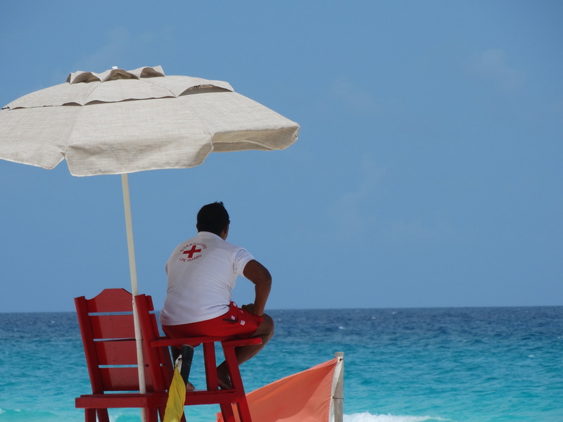 outdoors, rear view, security, life guard, day, nature, sky, cancun, seat, men, blue, observation, casual clothing, leisure activity, chair, water, horizon