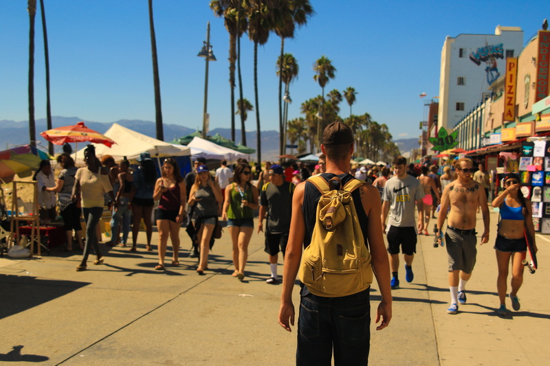 standing, walking, carrying, daytime, women, vacation, people, palm tree, real people, large group of people, sunlight, casual clothing, explore, backpack