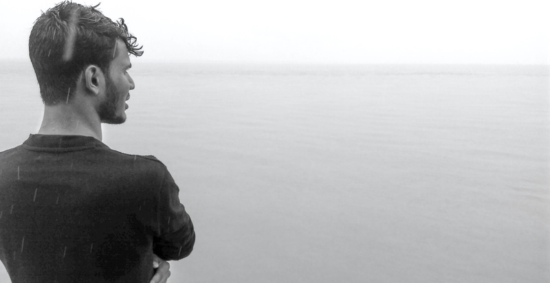 one person, portrait, shirt, man, ocean, wear, black, sea, lifestyles, real people, rear view, outdoors, young men, black-and-white, contemplation, headshot