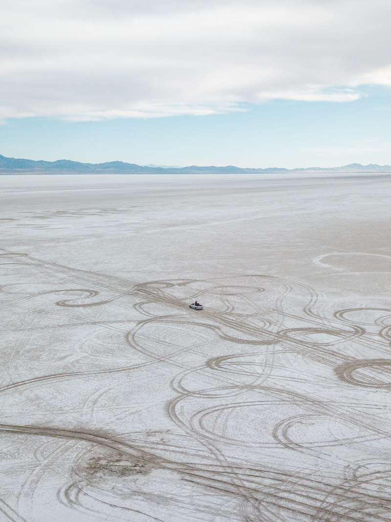 open, travelling, dirt, field, non-urban scene, cloud - sky, land, vehicle, landscape, no people, pattern, trail, aerial, day, beauty in nature, sand, scenics - nature