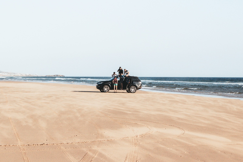 beach, suv, shore, horizon over water, sand, sea, parked, explore, outdoors, copy space, adult, vehicle, nature, transportation, sky, black, car, scenics - nature