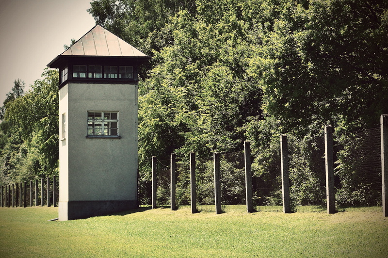 beauty in nature, field, green color, nature, death, growth, day, terrible, history, mass murders, grass, watchtower, past, architecture, no people, tranquil scene