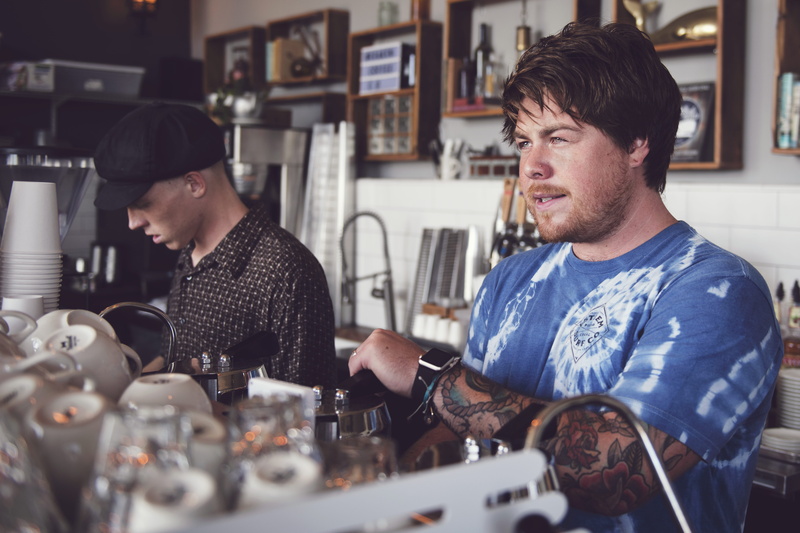 indoors, restaurant, person, pub, young adult, adult, avila beach, book, young men, kraken coffee company, footwear, preparation, pot, clothing, coffee - drink