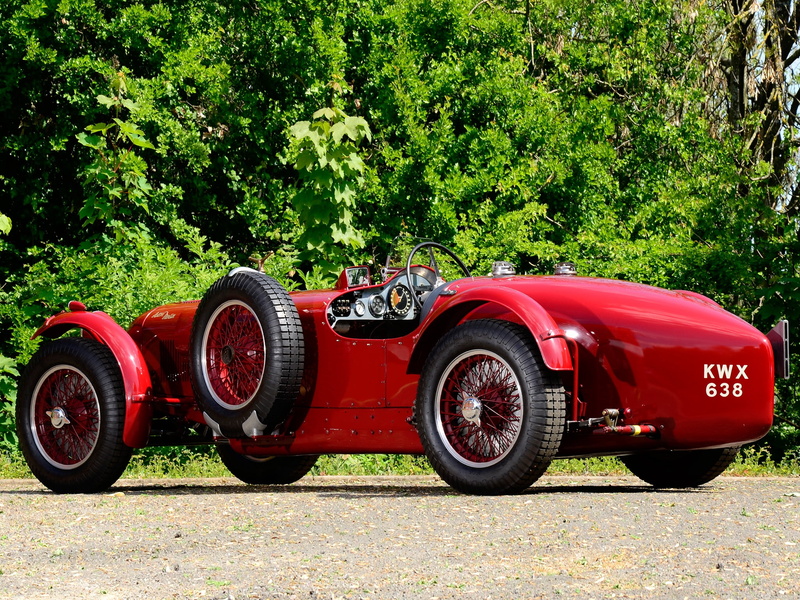convertible, road, side view, no people, mode of transportation, obsolete, motorsport, power, outdoors, front View, red, motor Vehicle, stationary, vintage Car