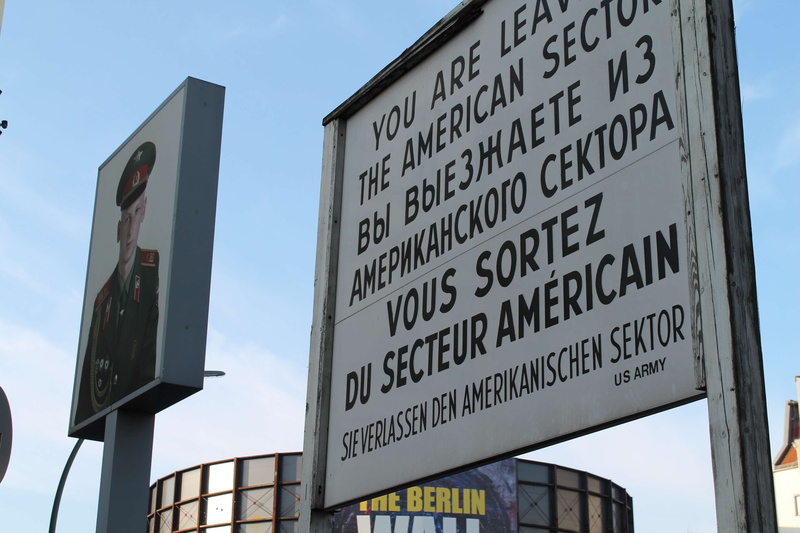 berlin, checkpoint charlie, german, sign, germany, outdoors, sky, information, office building exterior, no people, low angle view, built structure, non-western script