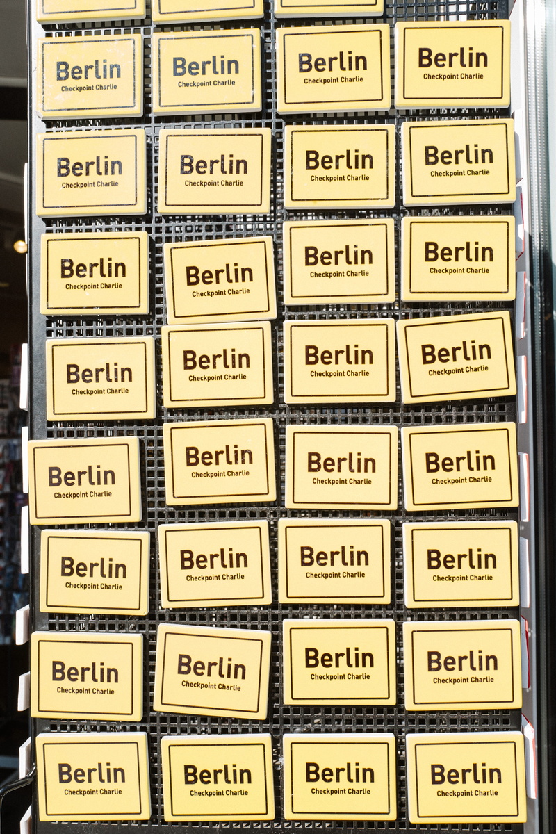 large group of objects, tourist, in a row, backgrounds, text, still life, high angle view, no people, side by side, indoors, 5K, germany, abundance, communication