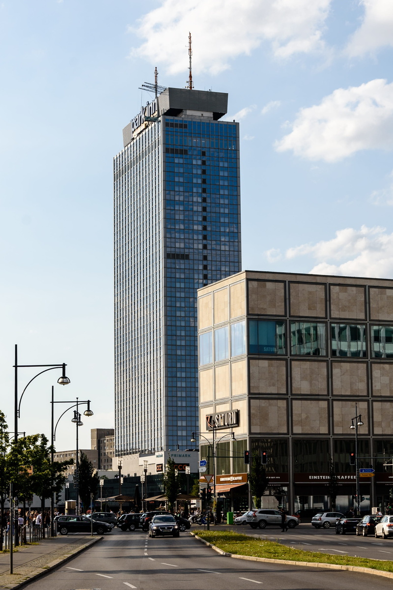 gdr architecture, travel, germany, tall - high, europe, road, skyscraper, building, cloud - sky, financial district, transportation, motor vehicle, incidental people