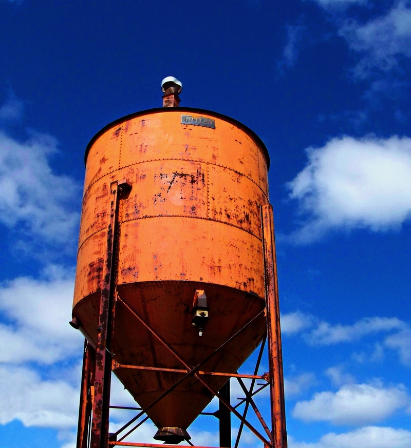 no people, outdoors, tall, day, storage tank, water conservation, rusty, blue, cloud - sky, orange, industry, nature, iron, tower, metal, sunlight, water tower - storage tank