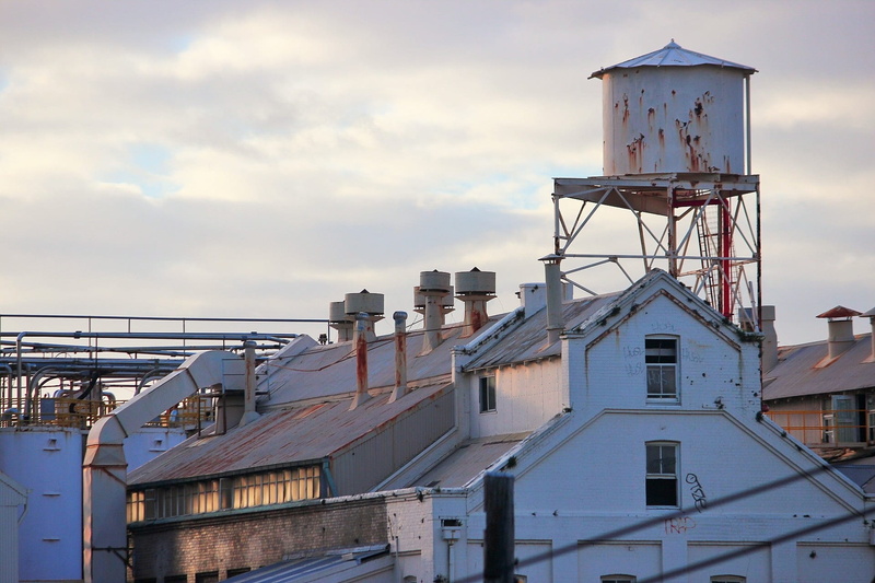 water tower - storage tank, technology, industry, cityscape, building, lewisham, low angle view, no people, city, contemporary, sky, factory, cloud - sky