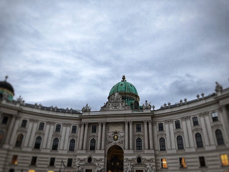 cloud - sky, sculpture, day, baroque, architectural column, brown, low angle view, hofburg imperial palace, clouds, monument, administration, dusk, travel