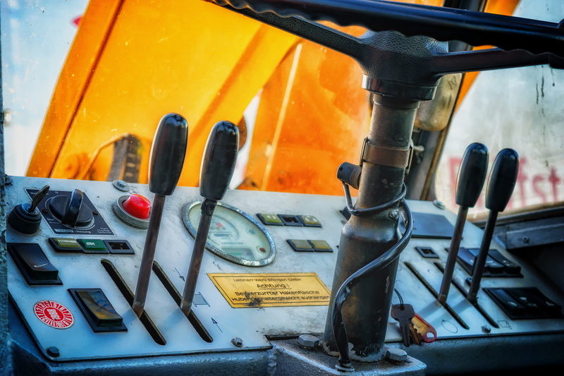 ad, metal, no people, garage, start, liebherr, control, steering wheel, communication, black, turn on, close, outdoors, 5K, detail, architecture, button