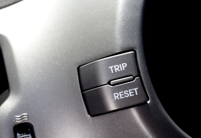 text, indoors, motor vehicle, silver colored, mode of transportation, car, start button, no people, electricity, push button, transportation, western script