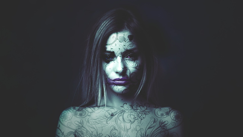 copy space, looking at camera, model, human face, tattoo, lifestyles, hairstyle, one person, black background, beautiful woman, women, studio shot, headshot