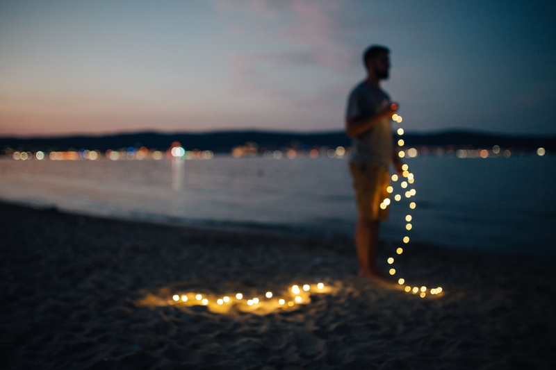 blur, bokeh, water, people, outdoors, christmas lights, 5K, standing, sunny beach, one person, man, summer, ocean, land, sea, contemplation, full length