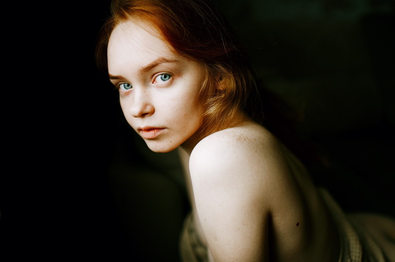 side view, headshot, human face, serious, young adult, indoors, black background, redhead, Marat Safin, portrait, women, focus on foreground, adult, close-up