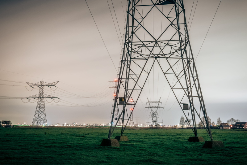 field, city, technology, lights, pastures, connection, urban, netherlands, cable, land, no people, architecture, day, houses, power lines, outskirts, outdoors