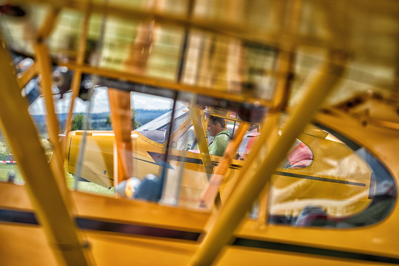 motion, 5K, no people, transportation, architecture, piloting, glass - material, yellow, piper cub, built structure, launch preparation, aircraft, indoors